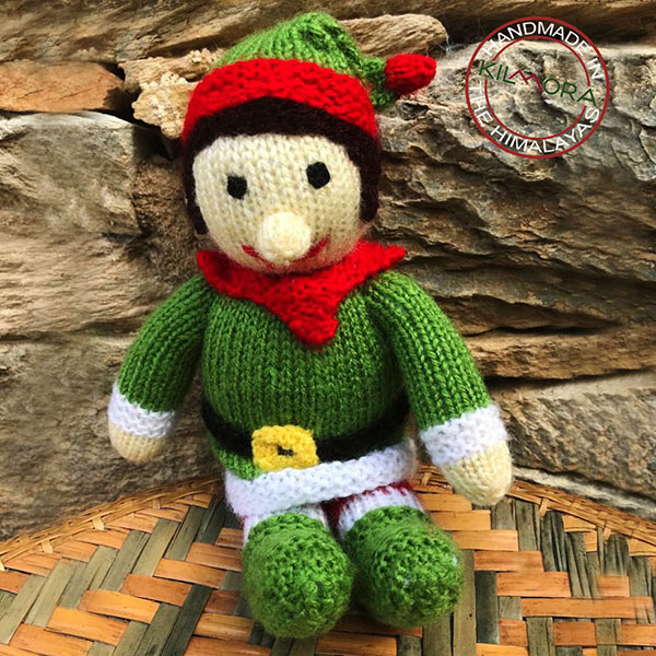 Hand-knitted elf on self